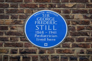 London, UK - March 18th 2024: A blue plaque on Queen Anne Street in London, UK, marking the location where paediatrician Sir George Frederic Still lived. clipart