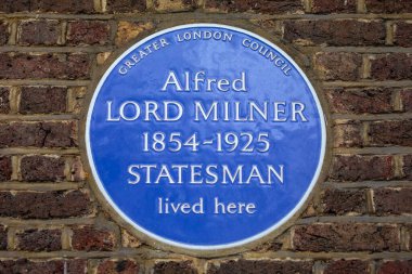 London, UK - March 18th 2024: A blue plaque on Manchester Square in London, marking where statesman Alfred Lord Milner lived. clipart