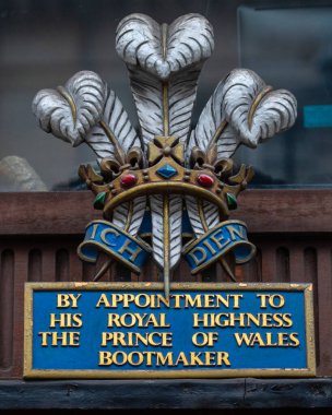 London, UK - March 18th 2024: Royal Warrant on the exterior of John Lobb Bootmaker on St. James's Street in London.  The company makes boots for HRH The Prince of Wales. clipart
