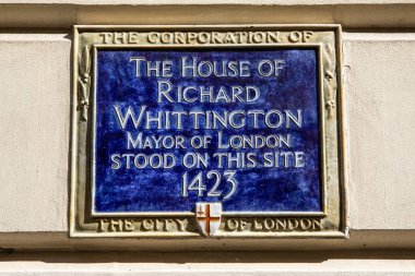 London, UK - April 17th 2023: Blue plaque on College Hill in London, marking where the house of Richard Whittington, also known as Dick Whittington, once stood in 1423.