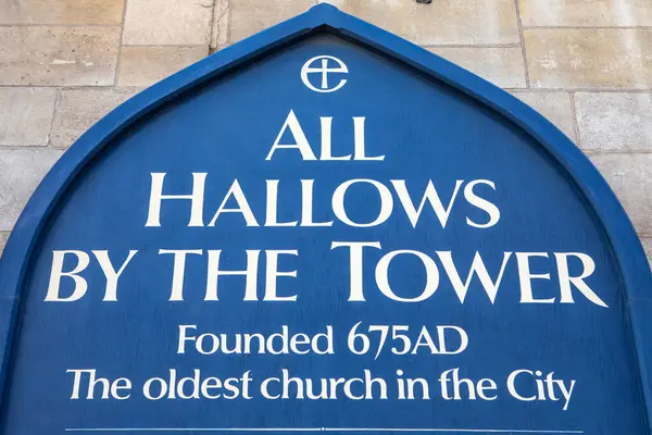 stock image London, UK - April 17th 2023: A sign at the entrance to the historic All Hallows by the Tower church in London, UK. It is the oldest church in the area of the City of London.
