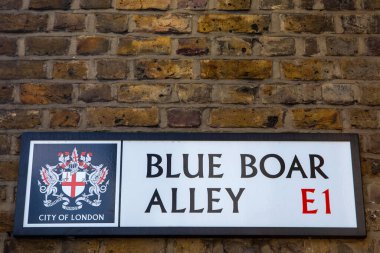 London, UK - March 2nd 2023: A street sign for Blue Boar Alley in the City of London, UK. clipart