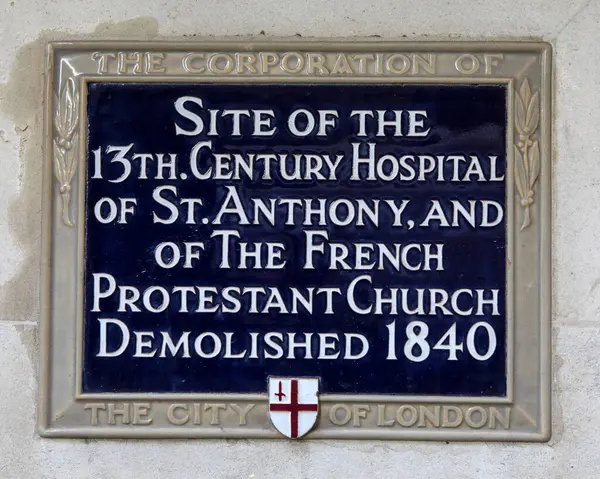 Stock image London, UK - March 2nd 2023: A blue plaque in the City of London, UK, marking the location where the 13th Century hospital of St. Anthony and of the French Protestant church.