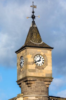 An elegant clocktower of a building previously used by Edinburgh Savings Bank, in the Stockbridge area of Edinburgh in Scotland. clipart