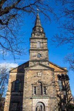 A view of the historic St. Cuthberts Church in the city of Edinburgh, Scotland. clipart
