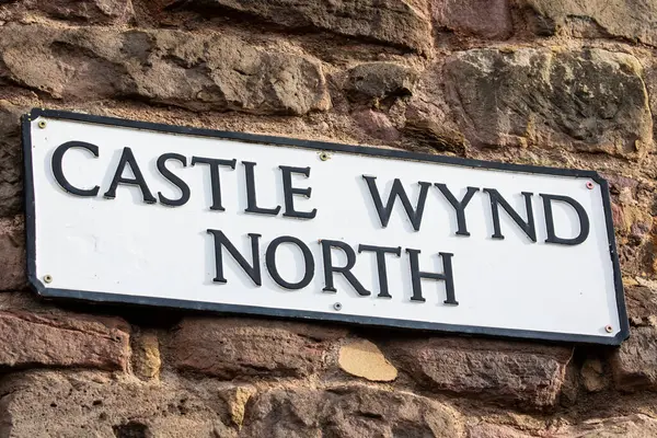 stock image A street sign for Castle Wynd North, located just off of the Royal Mile, in the old town area of Edinburgh, Scotland.