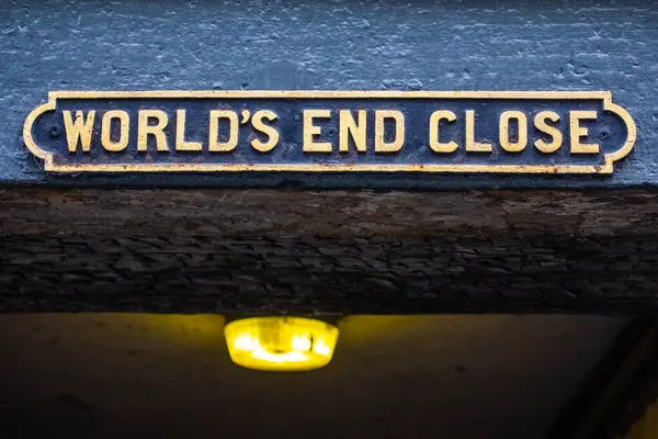 stock image Edinburgh, Scotland - February 15th 2023:  A sign above the entrance to Worlds End Close, located off of the historic Royal Mile in Edinburgh, Scotland.