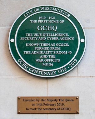 London, UK - April 20th 2023: Plaque on the exterior of Watergate House in London, marking the location of the first home of GCHQ- the UKs intelligence, Security and Cyber Agency. clipart