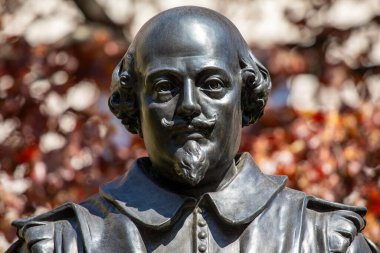 London, UK - April 20th 2023: Bust of famous playwright William Shakespeare, located in the old churchyard of St. Mary Aldermanbury on Love Lane, in the City of London, UK. clipart