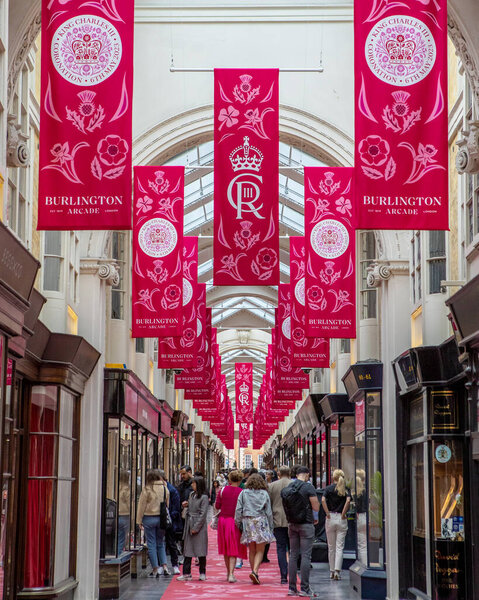 London, UK - April 30th 2023: Banners to commemorate the Coronation of His Majesty King Charles III, hanging in the Burlington Arcade in London, UK.