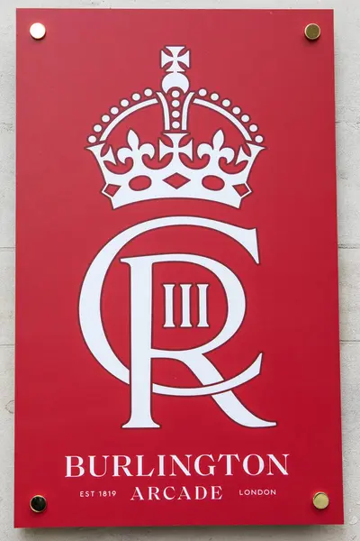 stock image London, UK - April 30th 2023: The cypher of King Charles III, on the exterior of Burlington Arcade in London, UK. The logo is on display to commemorate the Coronation of His Majesty.