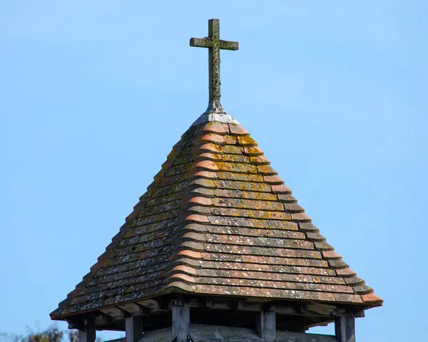 Stock image The wooden cross ontop of the tower of St. Agnes Church, located in the village of Freshwater, on the Isle of Wight, UK.