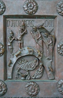 A fragment of the bronze entrance door of the world's largest Baptistery of San Giovanni in Pisa. Construction 1152-1363