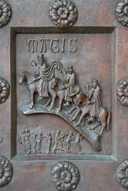 A fragment of the bronze entrance door of the world's largest Baptistery of San Giovanni in Pisa, Italy. Construction 1152-1363