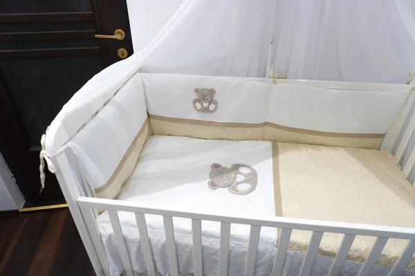 stock image White wooden baby crib child's bed