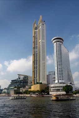 bangkok chao praya river modern buildings and ferry boat in thailand