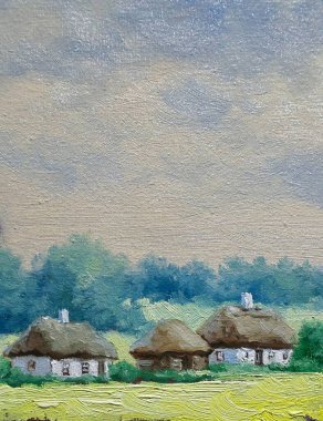 Beautiful rural landscape, old Ukrainian houses surrounded by a blooming garden of flowers, a wooden fence and thatched roofs, traditional house in the old village