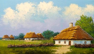 Beautiful rural landscape, old Ukrainian houses surrounded by a blooming garden of flowers, a wooden fence and thatched roofs, traditional house in the old village