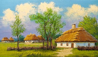 Beautiful rural landscape, old Ukrainian houses surrounded by a blooming garden of flowers, a wooden fence and thatched roofs, traditional house in the old village