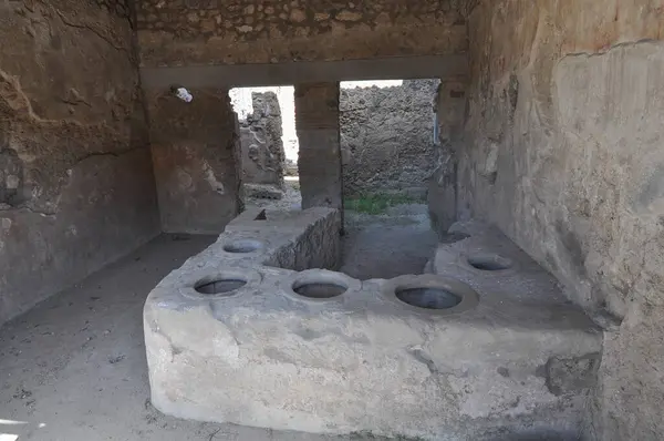 stock image Ruins of the archeological site in the ancient Roman city of Pompeii buried under volcanic ash in the eruption of Mount Vesuvius volcano in 79 AD in Pompeii, Italy