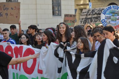 TURIN, ITALY - OCTOBER 11, 2024: Fridays for Future FFF School strike for climate clipart