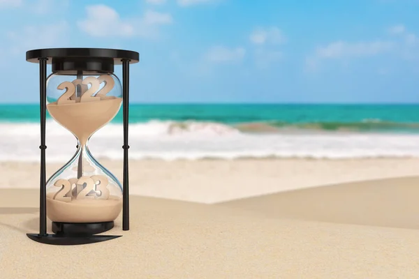 2023年正月休暇の概念 砂時計で落下する砂は 2022年から2023年までの1時間の形をとって 海洋性砂漠化した海岸の極端な閉鎖にあります 3Dレンダリング — ストック写真