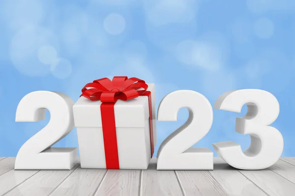 stock image 2023 New Year Sign with Gift Box and Red Ribbon on a wooden table. 3d Rendering 