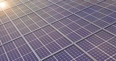 4k Resolution Video: Renewable Ecological Source of Sun Energy Concept. Top View of a New Photovoltaic Solar Panels Farm extreme closeup.