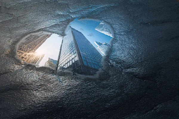 Love New York Concept. Reflection of Skyscrapers Buildings Street Through Puddle in Shape of Heart extreme closeup. 3d Rendering