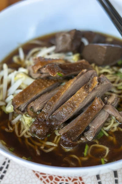 stock image egg noodles with stewed and braised duck in brown soup - Asian food style