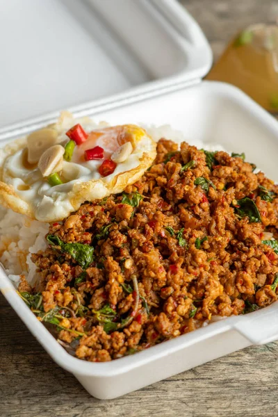 Stock image Stir fried Thai basil with minced pork and a fried egg on white plate