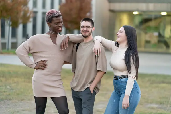 The Strength of Youth Diversity. Three young people smiling.
