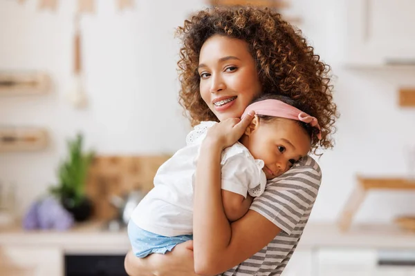 Happy Cheerful African American Mother Holds Laughing Baby Daughter Her — Stock Photo, Image
