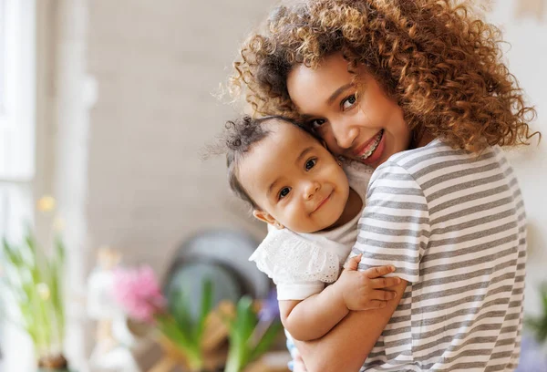 Happy Cheerful African American Mother Holds Laughing Baby Daughter Her — Stock Photo, Image