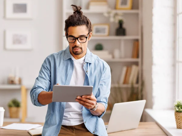 Concentrated African American Male Hipster Glasses Browsing Tablet Working Remotely Royalty Free Stock Photos
