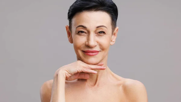 Positive Middle Aged Woman Bare Shoulders Short Dark Hair Touching — Stock Photo, Image