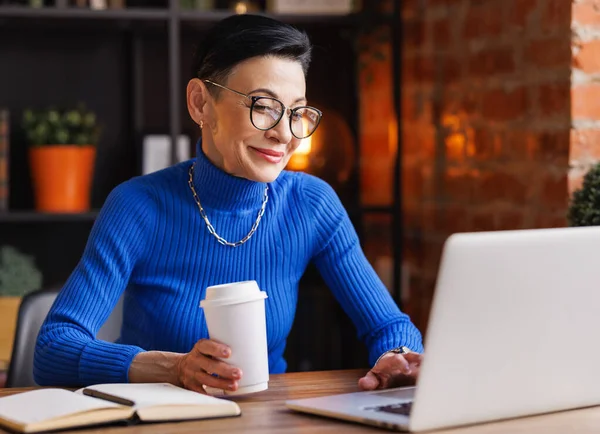 Middle Aged Female Manager Blue Turtleneck Stylish Glasses Cup Coffee — Stock Photo, Image