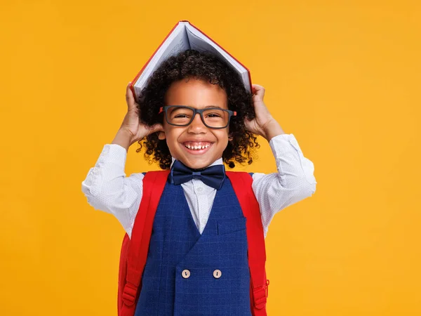 Delighted African American Boy Glasses Smiling Camera Putting Book Head — Stock Photo, Image