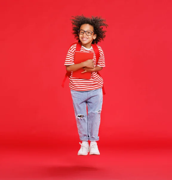 Full Length African American Boy Casual Clothes Book Jumping Red — Stock Photo, Image