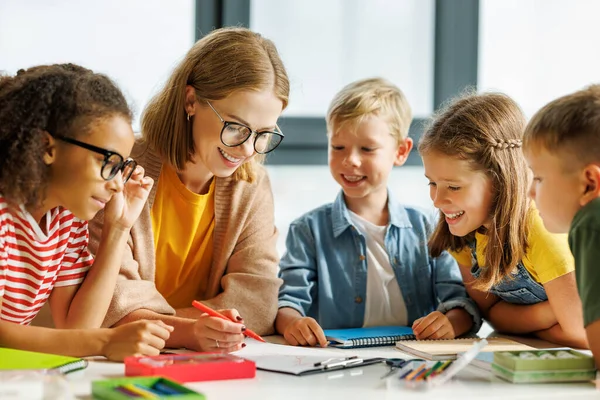 Smart Woman Teacher Glasses Helping Students Schoolwork Lesson Light Classroom — Stock Photo, Image