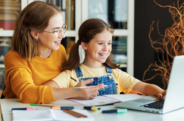 Smiling Teacher Mother Schoolgirl Browsing Laptop While Doing Assignment Together — Stock Photo, Image