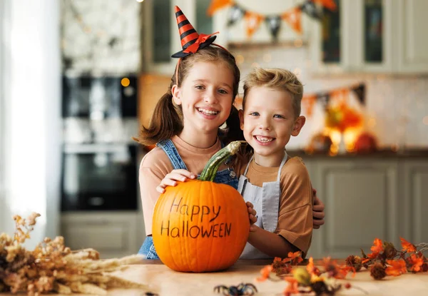 Happy Children Brother Sister Smiling Camera Showing Pumpkin Inscription Happy — Stock Photo, Image