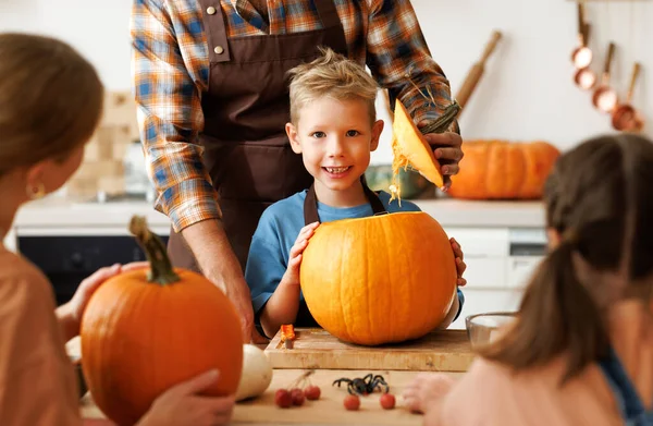 Happy Boy Smiling Camera While Helping Dad Carve Pumpkin Cheerful Stock Image