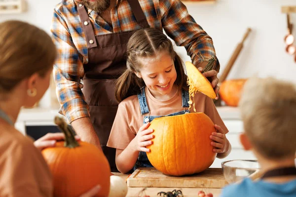 Happy Girl Helping Dad Carve Pumpkin Cheerful Family Preparing Halloween Royalty Free Stock Images