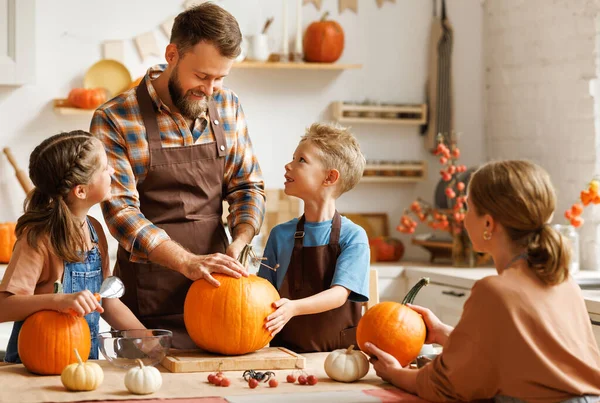 Cute Happy Little Boy Helping His Father Carve Halloween Pumpkin Stock Photo