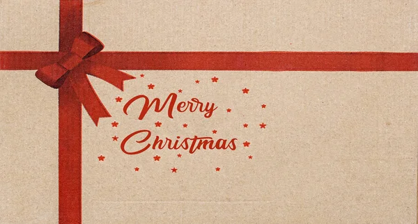 メリークリスマスのコンセプトの赤いギフト弓カートンカード — ストック写真