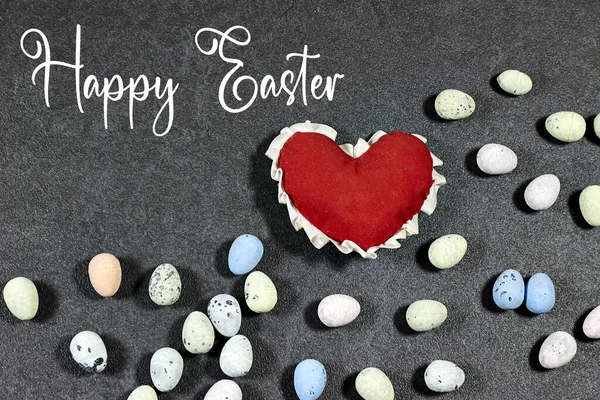 colorful easter eggs with heart shape  on grunge gray background