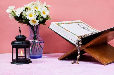 ornamental Arabic lantern with burning candle glowing. Festive greeting card. Invitation for Muslim holy month or eid