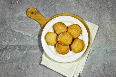 homemade Algeria Donut with apricot jam and powdered with sugar