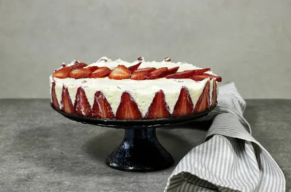 strawberry cake or Fraisier in french language on stand cake